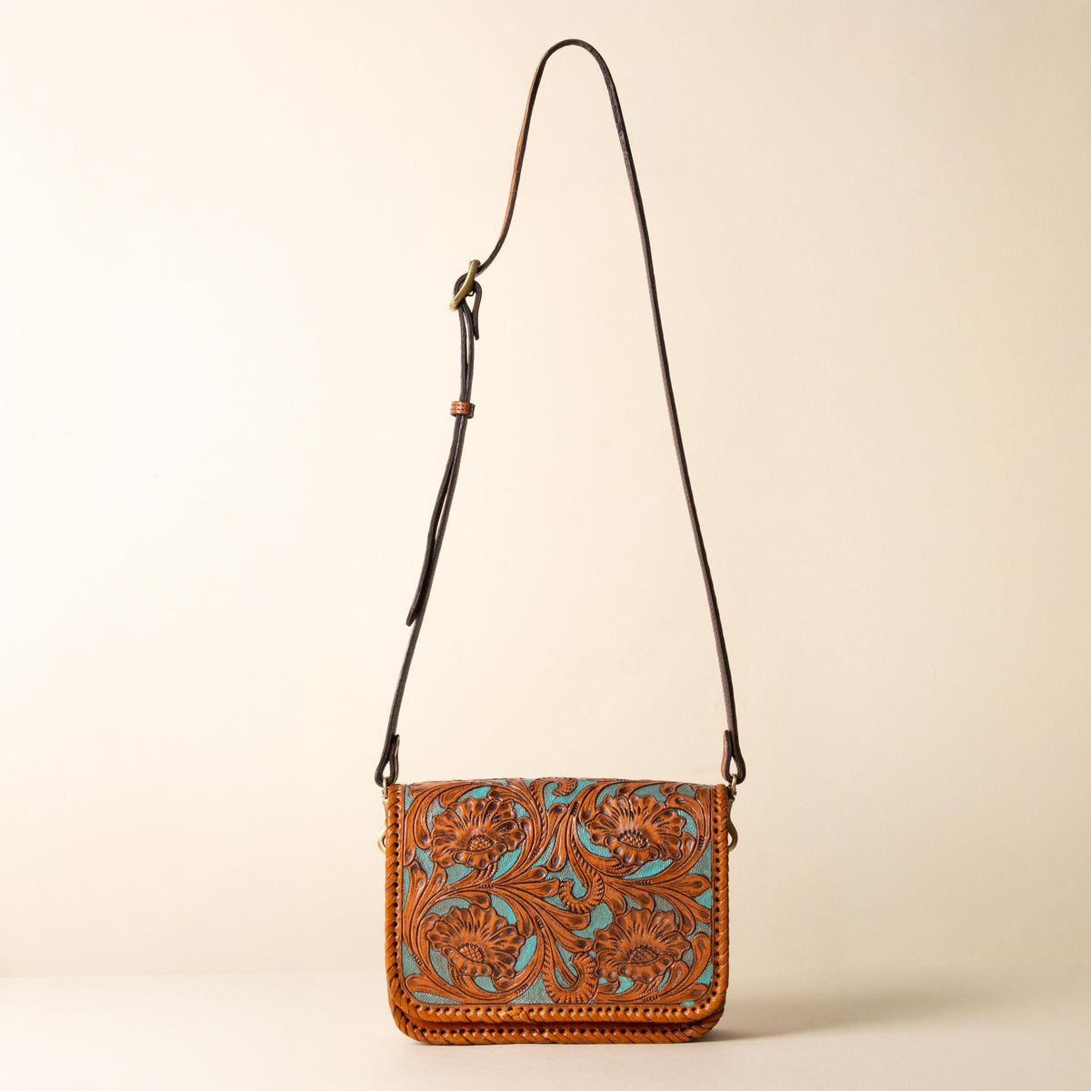 Hand-tooled leather crossbody bag with four floral medallions and braided edge, photo 7