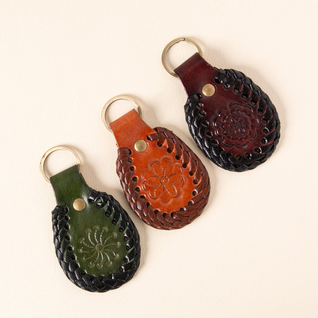 Hand-tooled leather teardrop keychains in forest green, cognac and oxblood with floral medallions and braided edges, photo 2