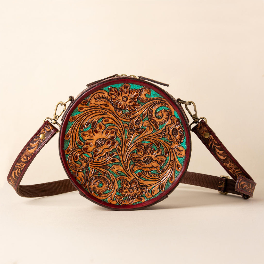 Hand-tooled leather round canteen crossbody bag with turquoise floral scrollwork, photo 1