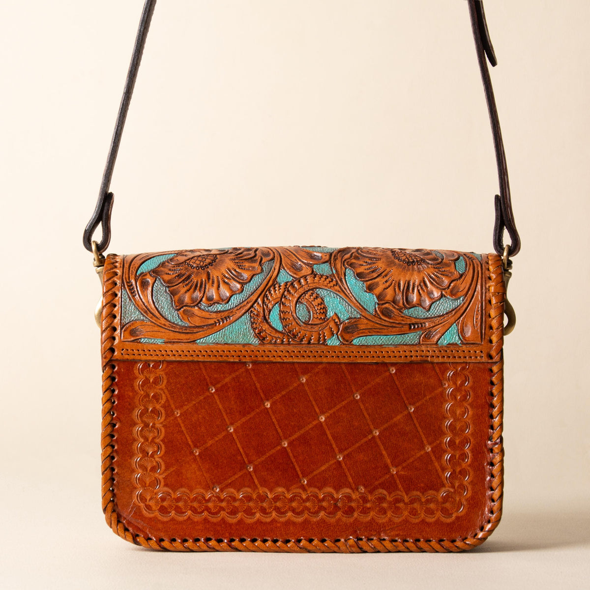 Hand-tooled leather crossbody bag with four floral medallions and braided edge, photo 3
