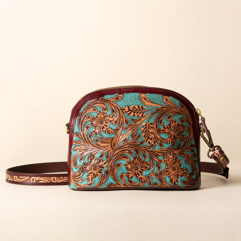 Hand-tooled leather dome crossbody bag with turquoise floral tooling and oxblood trim, photo 1