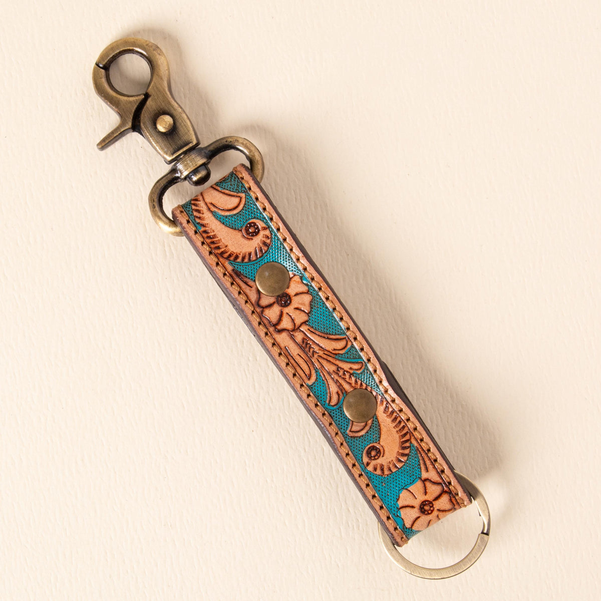 Hand-tooled leather floral keychains with feather, vine and sunflower designs, photo 9