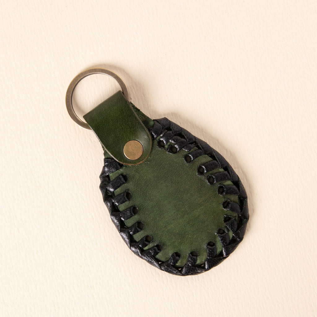 Hand-tooled leather teardrop keychains in forest green, cognac and oxblood with floral medallions and braided edges, photo 8