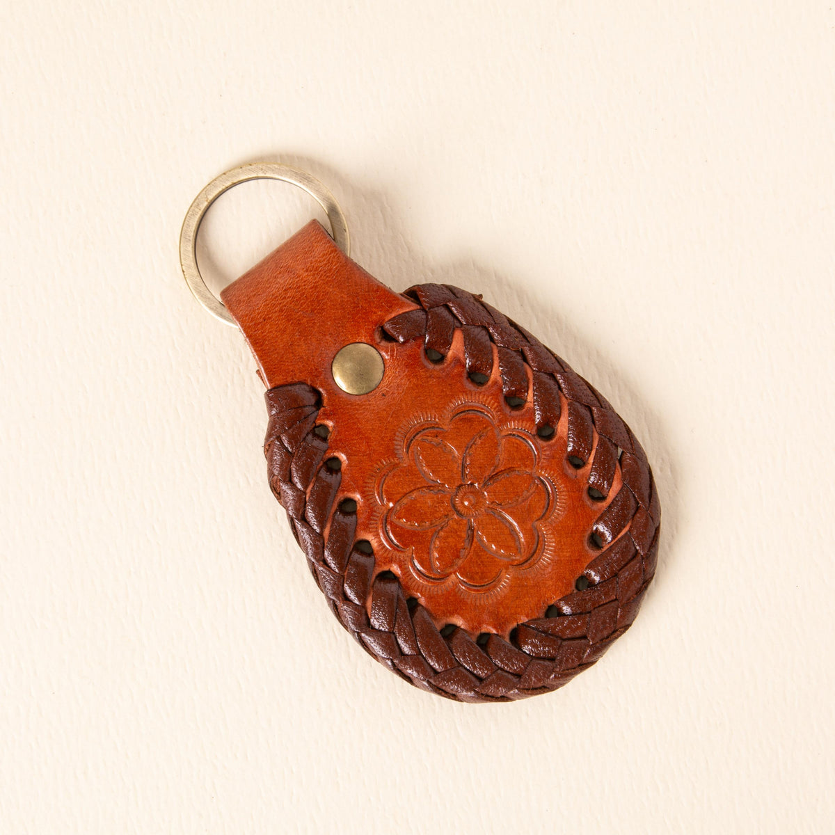 Hand-tooled leather teardrop keychains in forest green, cognac and oxblood with floral medallions and braided edges, photo 5
