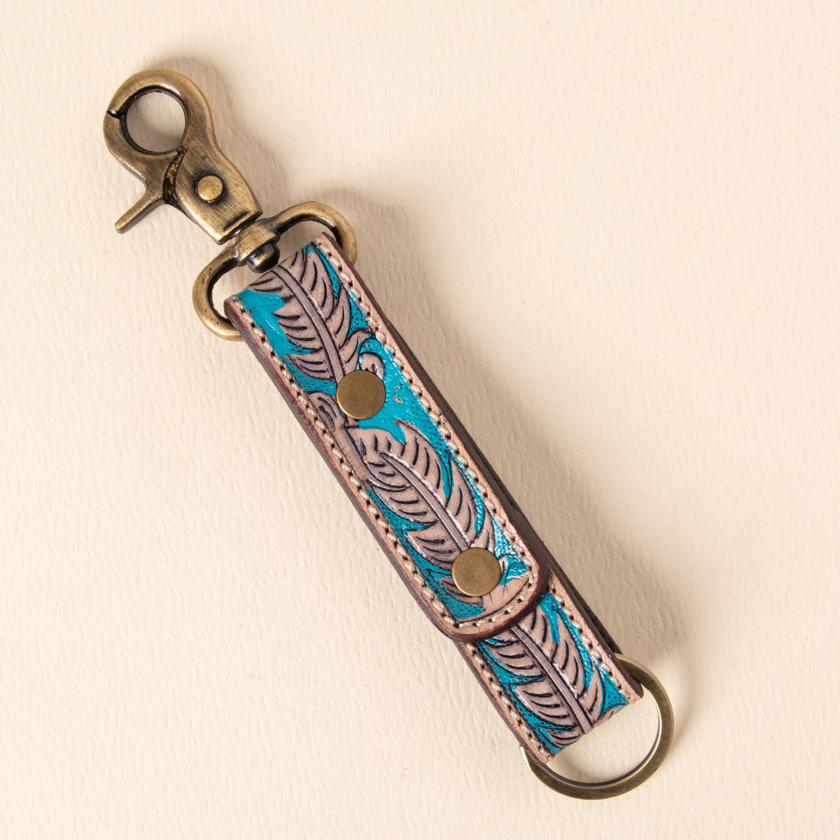 Hand-tooled leather floral keychains with feather, vine and sunflower designs, photo 4