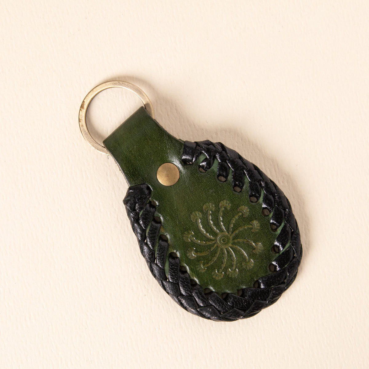 Hand-tooled leather teardrop keychains in forest green, cognac and oxblood with floral medallions and braided edges, photo 7